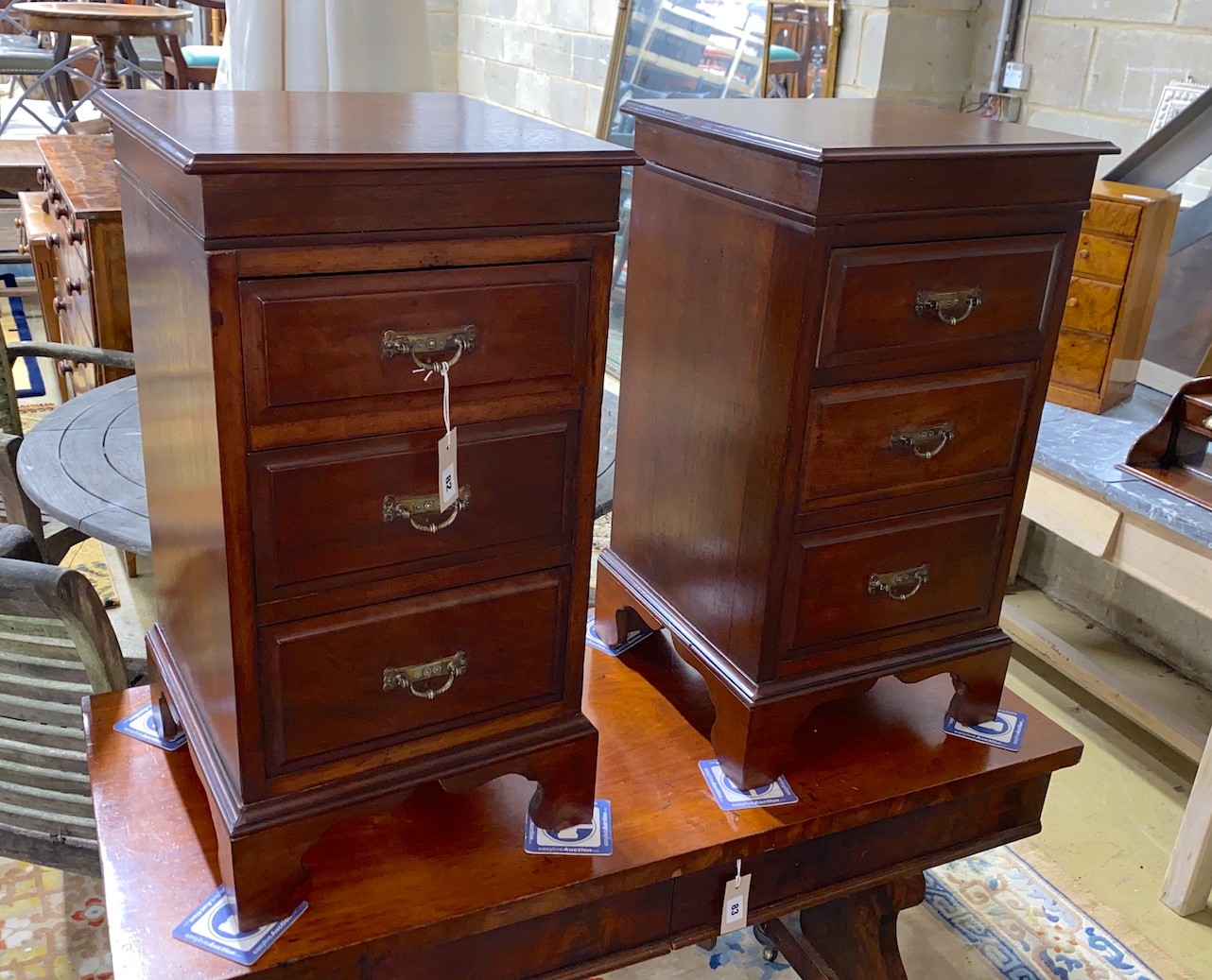 A pair of Victorian and later mahogany three drawer bedside chests (altered), width 39cm, depth 39cm, height 73cm